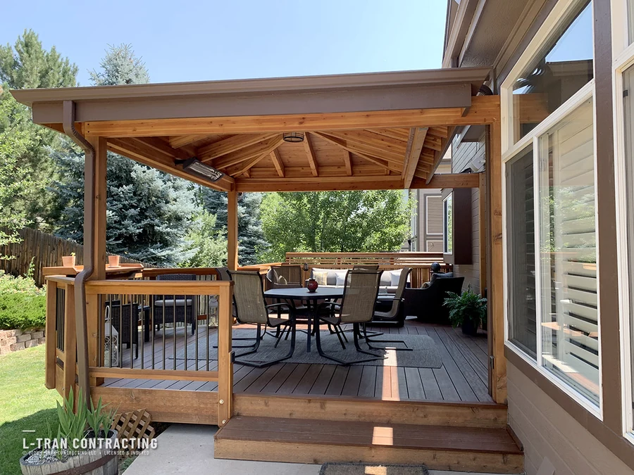 Covered deck with vaulted cedar ceiling and dining area