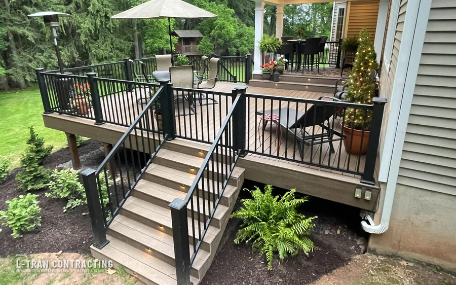 Deck stairs with built-in lighting leading to dining area