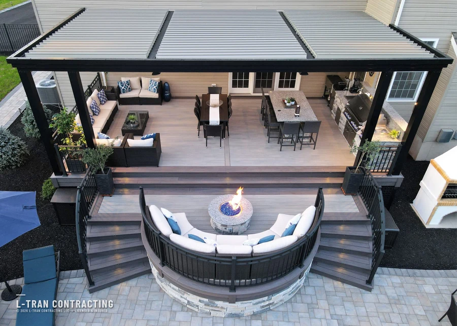 Aerial view of pergola deck with fire pit lounge and outdoor kitchen
