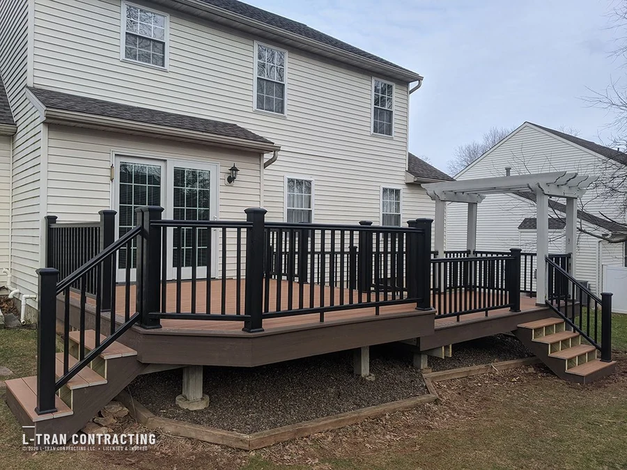 Deck with white pergola backdrop