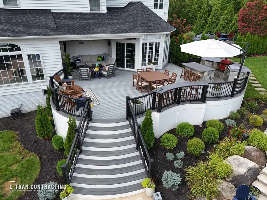 Curved deck with outdoor kitchen and umbrella