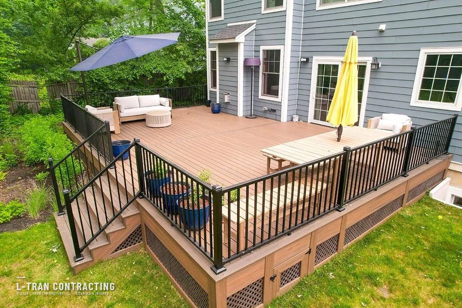 Deck with dining bench and colorful umbrellas