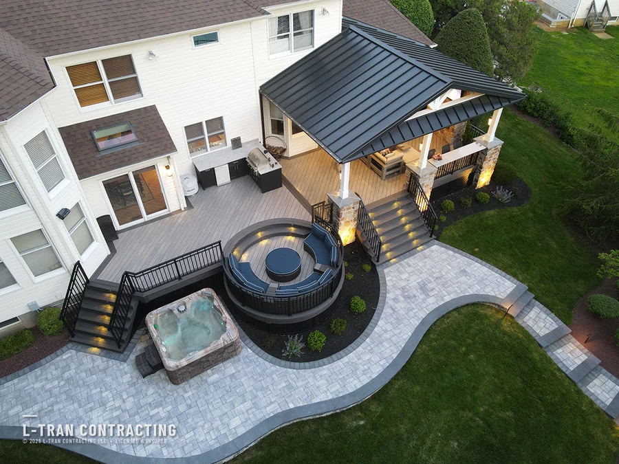 Aerial view of composite deck with built-in hot tub and covered lounge