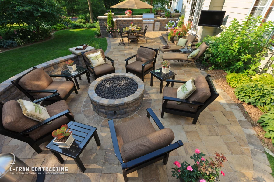 Stone patio with fire pit and lounge seating